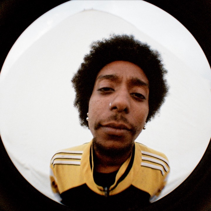 Fisheye portrait: a man in a yellow and black jacket