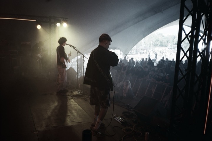 A guitarist in stage haze
